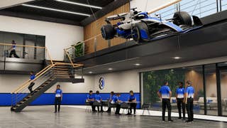 An F1 facility with a hanging F1 display car in F1 25's MyTeam 2.0 mode.